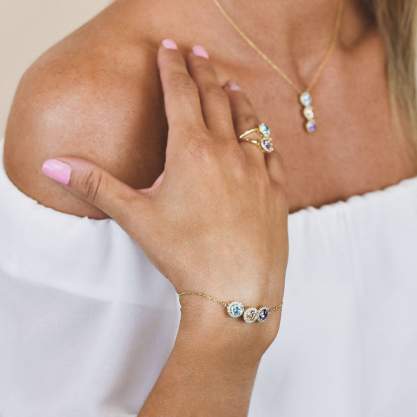 bracciale boccadamo BR601DM oro giallo con centrale a tre cristalli tanzanite, pesca, acquamarina e zirconi