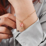 CL/BR08 Mya Boccadamo Bracciale placcatao oro giallo con campanella portafortuna rossa